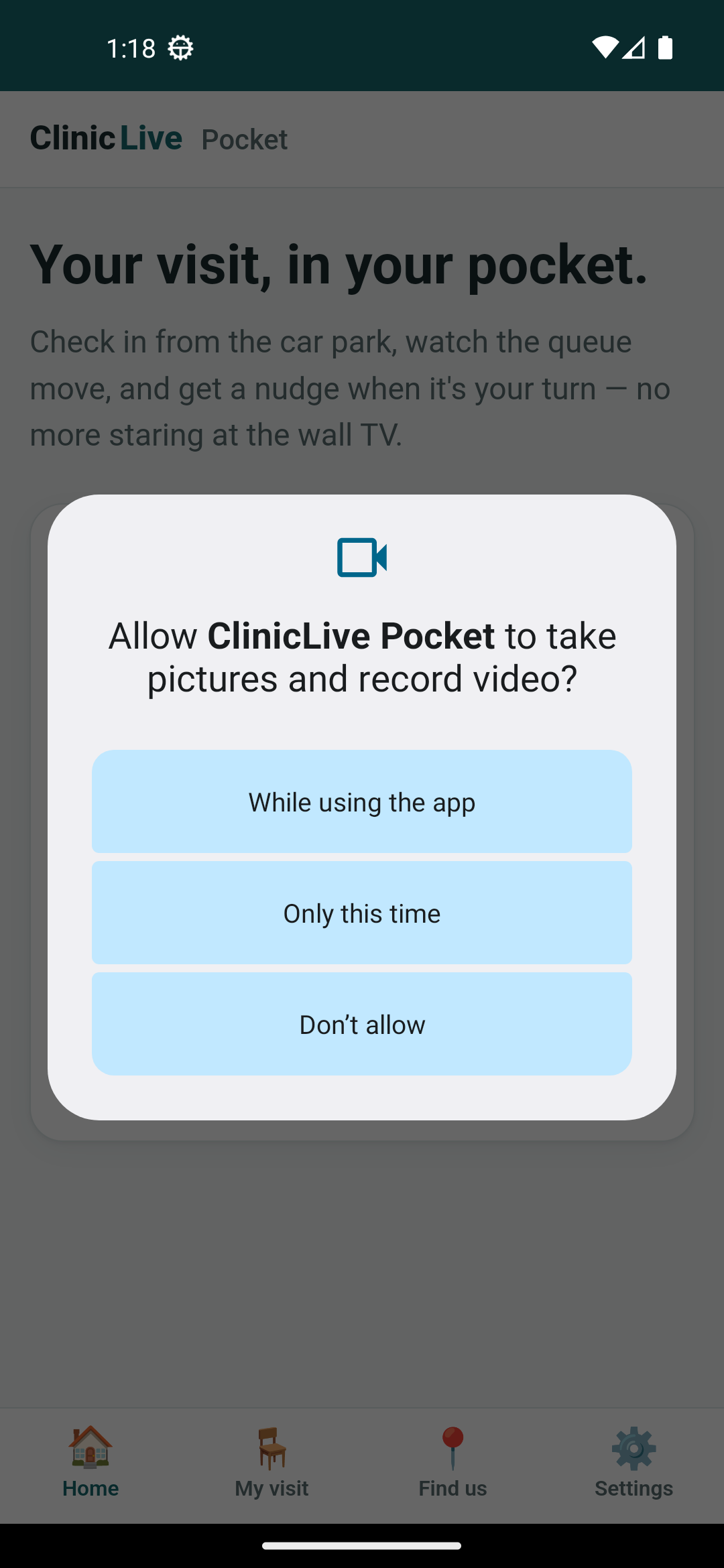Android's camera permission dialog, 'Allow ClinicLive Pocket to take pictures and record video?', over the Home screen